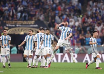 LUSAIL CITY, QATAR - DECEMBER 18: Lionel Messi of Argentina celebrates with teammates in the penalty shootout during the FIFA World Cup Qatar 2022 Final match between Argentina and France at Lusail Stadium on December 18, 2022 in Lusail City, Qatar. (Photo by Julian Finney/Getty Images)