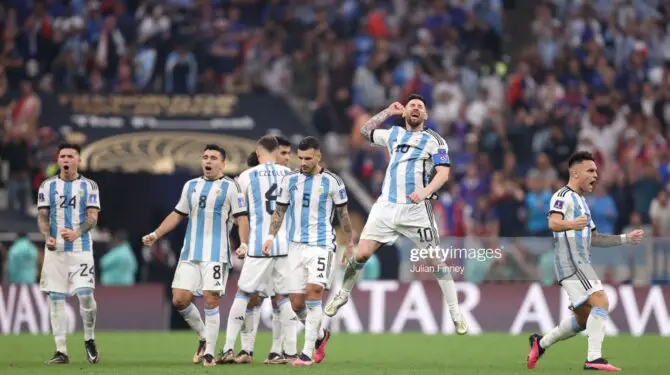 LUSAIL CITY, QATAR - DECEMBER 18: Lionel Messi of Argentina celebrates with teammates in the penalty shootout during the FIFA World Cup Qatar 2022 Final match between Argentina and France at Lusail Stadium on December 18, 2022 in Lusail City, Qatar. (Photo by Julian Finney/Getty Images)